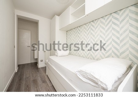 Bedroom with single bed and wardrobe bridge and white bookshelf