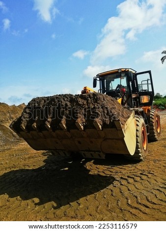 Payloader machine used in construction and building sites  Royalty-Free Stock Photo #2253116579