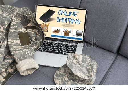 military uniform and laptop with online shopping