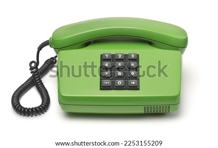 Front view of green classic push-button landline phone isolated on white Royalty-Free Stock Photo #2253155209