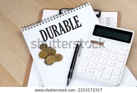 DURABLE text with chart and calculator and coins , business c