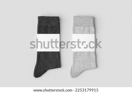 Light and dark grey socks mockup with blank label. Royalty-Free Stock Photo #2253179915