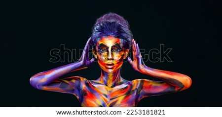 Girl with art colorful make-up and bodyart or body paints. Download photo for cover on your video project. Covers for books mixtape and video clips
