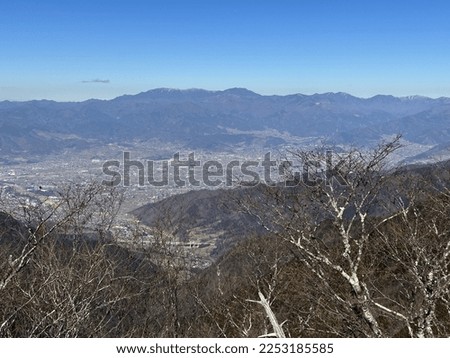 Okuchichibu seen from the summit of Mt. Shakagatake in the Misaka Mountains in winter Royalty-Free Stock Photo #2253185585