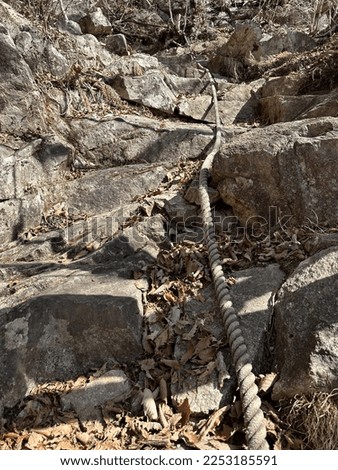 A rope on the mountain trail of Mt. Shakagatake in the Misaka Mountains in winter Royalty-Free Stock Photo #2253185591