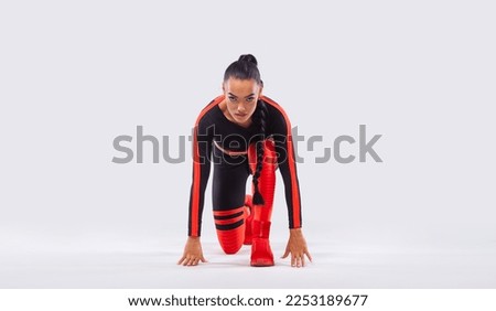 Fit athletic woman sprinter, running on white background. Fitness and sport. Runner concept with copy space. Athlete isolated on white background. Picture for advertising of gym or fitness club.