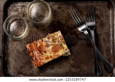 One piece of pizza on an old tray. Last piece. Diet, food restriction concept.