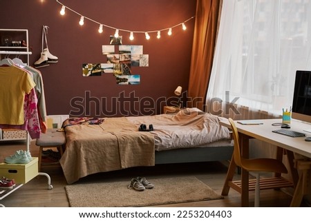 Background image of teenagers room with lights and pictures on wall, copy space Royalty-Free Stock Photo #2253204403