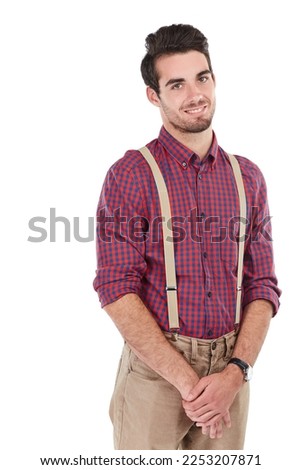 Nerd, geek and portrait of a hipster in studio with white background isolated with a beard. Smiling, smart and nerdy style clothes of male standing with happiness and smile feeling positive in plaid