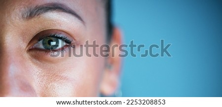 Eye, face and mockup with woman in portrait, vision and eye care with ophthalmology isolated on blue background. Eyebrow, future and perception, contact lens and lashes, awareness and focus in studio