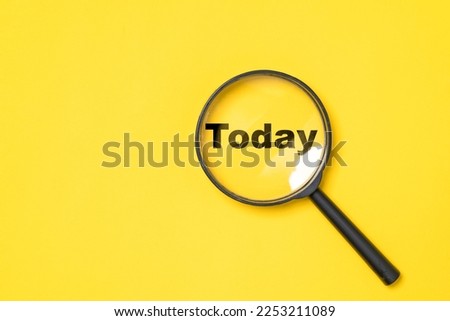 Today wording inside of Magnifier glass on yellow  background for focus current situation , positive thinking mindset concept.
