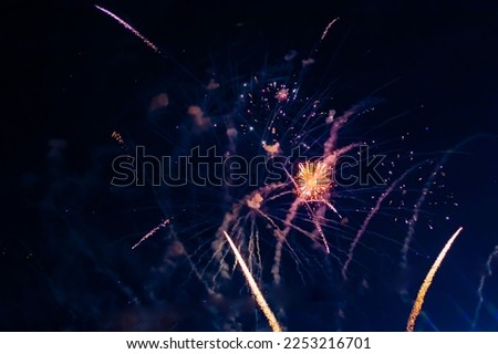 Inexpensive, budget, beautiful fireworks in the city, against the backdrop of the night sky. High quality photo