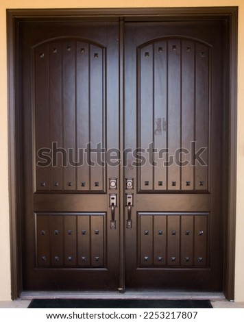 Large Heavy Wooden French Double Doors, Dark Brown Royalty-Free Stock Photo #2253217807
