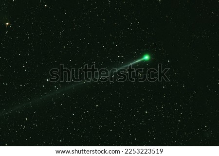 Green comet in dark space. Elements of this image furnished by NASA. High quality photo