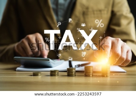 Tax payment and tax deduction planning involve strategies to minimize tax liability. This includes maximizing deductions and credits, deferring income, and accelerating deductions. tax professional Royalty-Free Stock Photo #2253243597