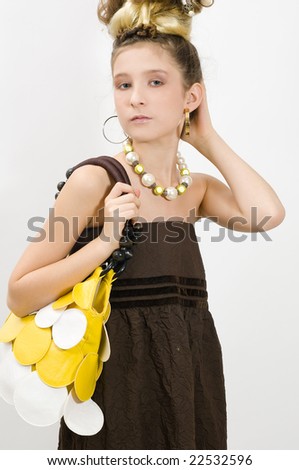 Shopping girl showing off fashion jewellery and handbag