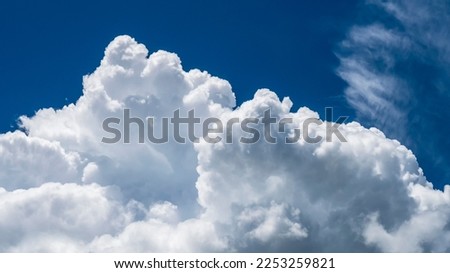 Blue sky fluffy white clouds on summer season bright clear skyline with beautiful cloudscape. Panorama blue sky clouds pattern on daylight with copy space. Cumulus cloudscape air climate sunny day Royalty-Free Stock Photo #2253259821
