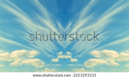 A left-right symmetrical image of a winter sky with white clouds in the form of birds spreading their wings across the soft blue sky. 