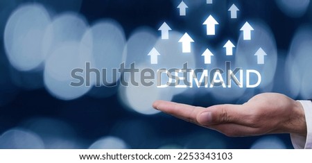Male hand showing growing arrows and inscription Demand. Business  Royalty-Free Stock Photo #2253343103