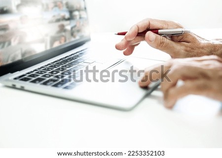 Close-up view, asian businessman using laptop computer working from home and meeting online with business group, white background