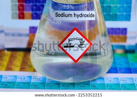sodium hydroxide and periodic table of elements, learning in the laboratory  Royalty-Free Stock Photo #2253352215