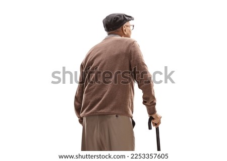 Elderly man standing with a cane isolated on white background Royalty-Free Stock Photo #2253357605