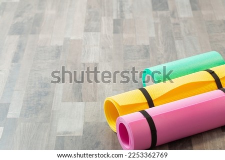 fitness mat on wooden floor at home