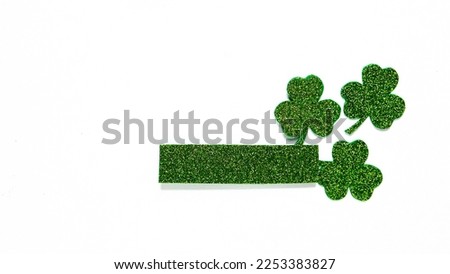 Happy St. Patrick's Day banner.Holiday background.St Patricks Day frame against a white background. Flat lay shamrocks.Copy space.Patrik's day banner Royalty-Free Stock Photo #2253383827
