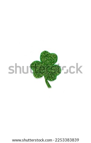 Happy St. Patrick's Day banner.Holiday background.St Patricks Day frame against a white background. Flat lay shamrocks.Copy space.Patrik's day banner Royalty-Free Stock Photo #2253383839