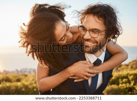 Wedding, interracial and couple hug in nature, happy and excited while celebrating love, beginning and romance. Romantic, marriage and happy black woman bride with groom embrace, cheerful and smile Royalty-Free Stock Photo #2253388711