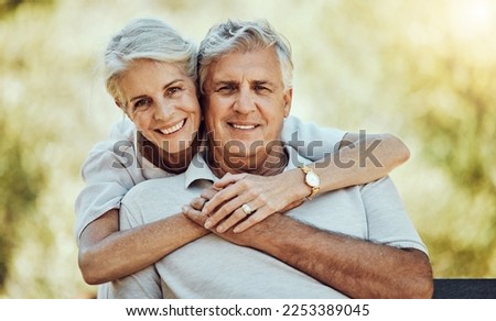 Old couple hug in park, love and marriage portrait, retirement together with commitment and outdoor. Mature man, elderly woman and care with trust and support, nature and happiness in relationship