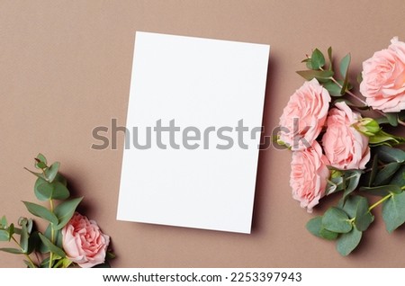 Invitation card mockup with fresh pink roses and eucalyptus flowers