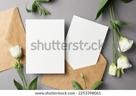 Blank wedding invitation card mockup with flowers and envelopes, front and back sides, mockup with copy space