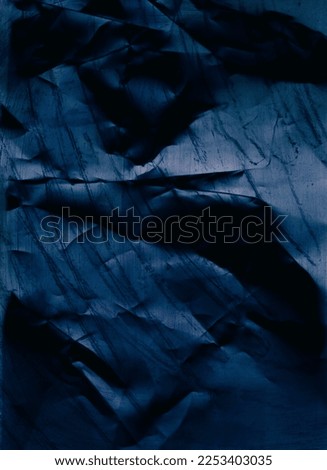 Creased texture. Distressed paper. Wrinkled noise. Blue color grain dust scratches on dark uneven rough grunge abstract background.