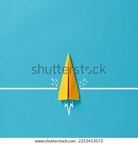 Conquering adversity to achieve goals. Determination to overcome barriers and difficulties. Paper airplane crashes a wall and moves forward. Royalty-Free Stock Photo #2253412073