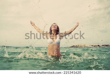 Woman enjoying her vacation in the sea.