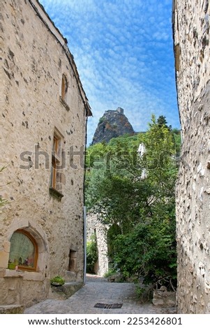 Château de Rochemaure, narrow street in the medieval village overlooking the rock with the castle