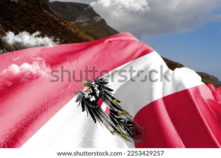 Austria national flag cloth fabric waving on beautiful mountain background.