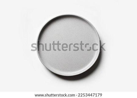 Top view empty blank ceramic round grey gray plate isolated on white background with clipping path. Royalty-Free Stock Photo #2253447179