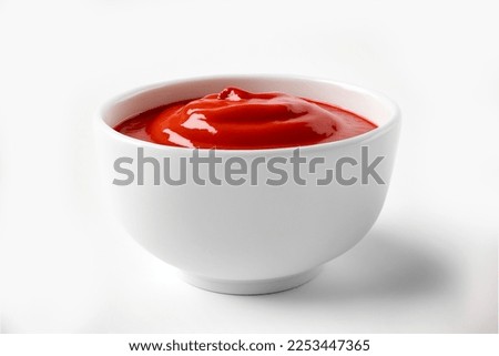Delicious ketchup in white bowl isolated on white background. Portion of tomato sauce with clipping path. Collection of various sauces Royalty-Free Stock Photo #2253447365