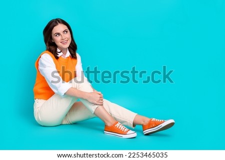 Full length photo cadre of dreamy businesswoman wear office outfit sitting comfort look empty space new vacancy isolated on cyan color background