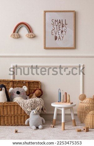 Cozy composition of kids room interior with mock up poster frame, wicker basket, plush animal toys, braided plaid, white stool, beige wall with stucco and personal accessories. Home decor. Template.