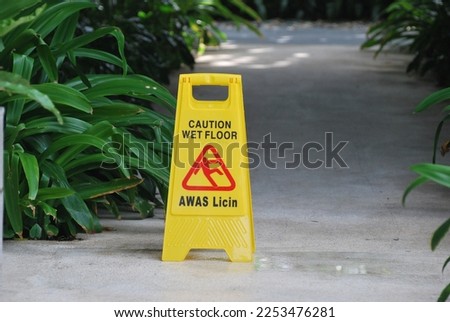 The caution wet floor sign is yellow and placed on the floor so that people who pass through the floor are careful not to fall because the floor is wet.