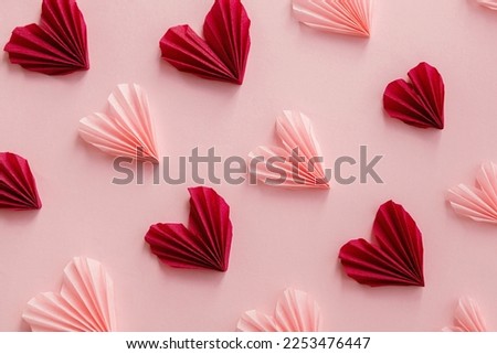 Valentines day flat lay. Stylish pink and red hearts composition on pink paper background. Happy Valentine's day! Modern cute valentine hearts cutouts. Creative love background Royalty-Free Stock Photo #2253476447