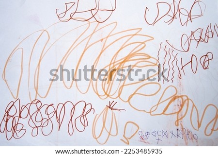 Children draw doodles. Multicolored bright chaotic lines. Prints for clothes, art, background for design Royalty-Free Stock Photo #2253485935
