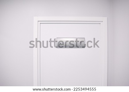 A white door with a sign. An office in a laboratory or hospital