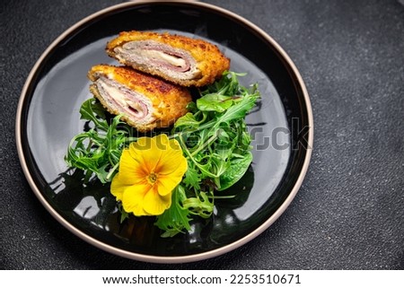 cutlet cordon bleu chicken meat, cheese, bacon healthy meal food snack on the table copy space food background rustic top view Royalty-Free Stock Photo #2253510671