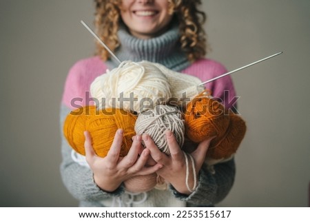 Art creative woman hands with yarn balls for knitting. Selective focus. Creative concept. People lifestyle concept. Royalty-Free Stock Photo #2253515617
