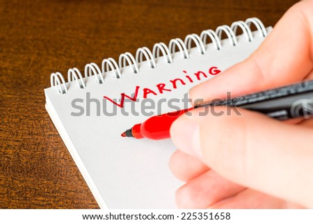 Warning, sign in the notebook by red marker