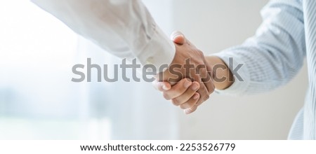 Businessman shaking hands successful making a deal. mans handshake. Business partnership Real estate meeting home purchase agreement concept Royalty-Free Stock Photo #2253526779